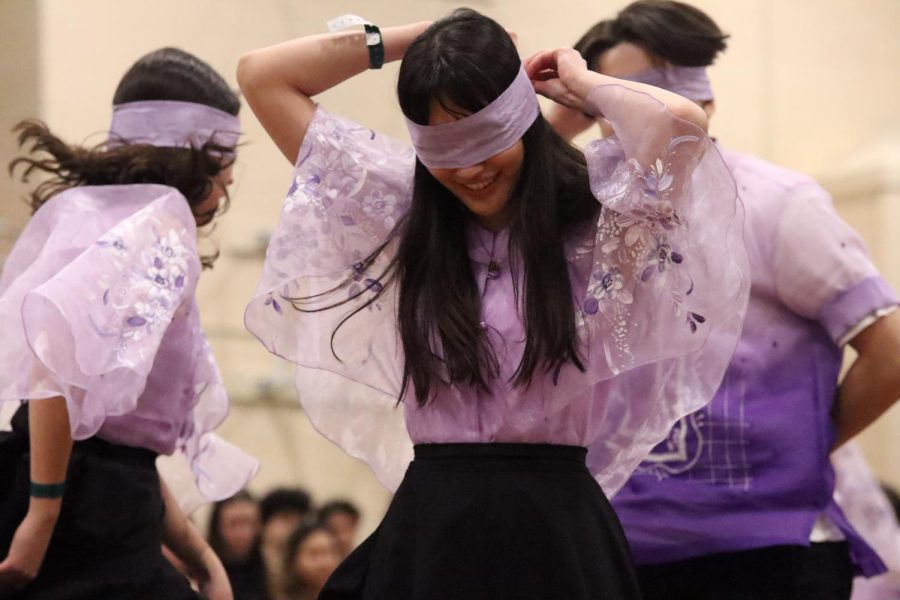 Senior Katrina Alban of Filipino Club dances the Tinikling blindfolded.