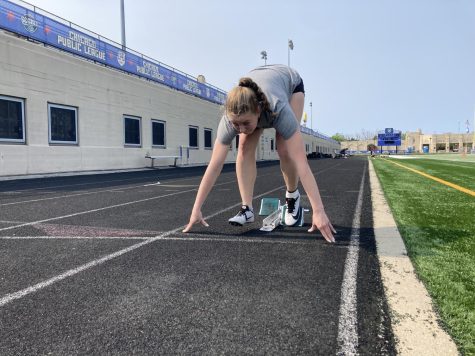 State 200 meter qualifier Charlotte Price lines up in race position during practice on May 17.