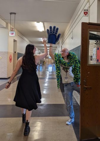 Junior Jordan Freehling and CS teacher Daniel Stone high-five outside Room 230. (Photo courtesy of Mr. Stone)