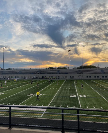 The sun sets in the stadium as Lane boys soccer sets up to begin the game against Libertyville.