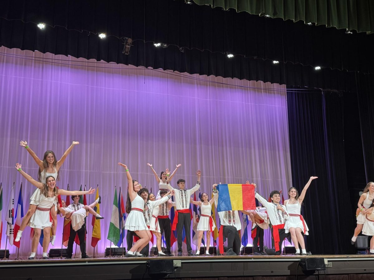 Romanian Club took a club pose after finishing dancing at I-Days on March 6 after school.