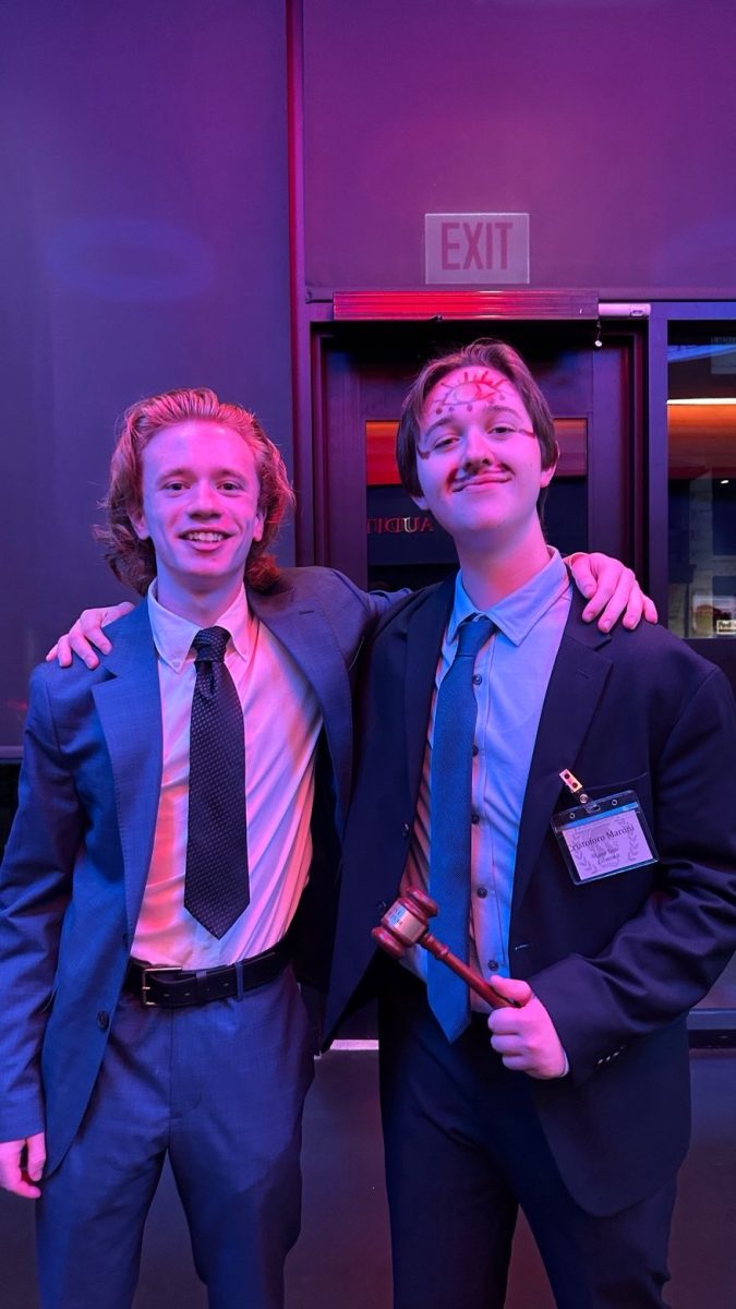 Jackson Kochowicz and another Model UN member smile for a photo. 
