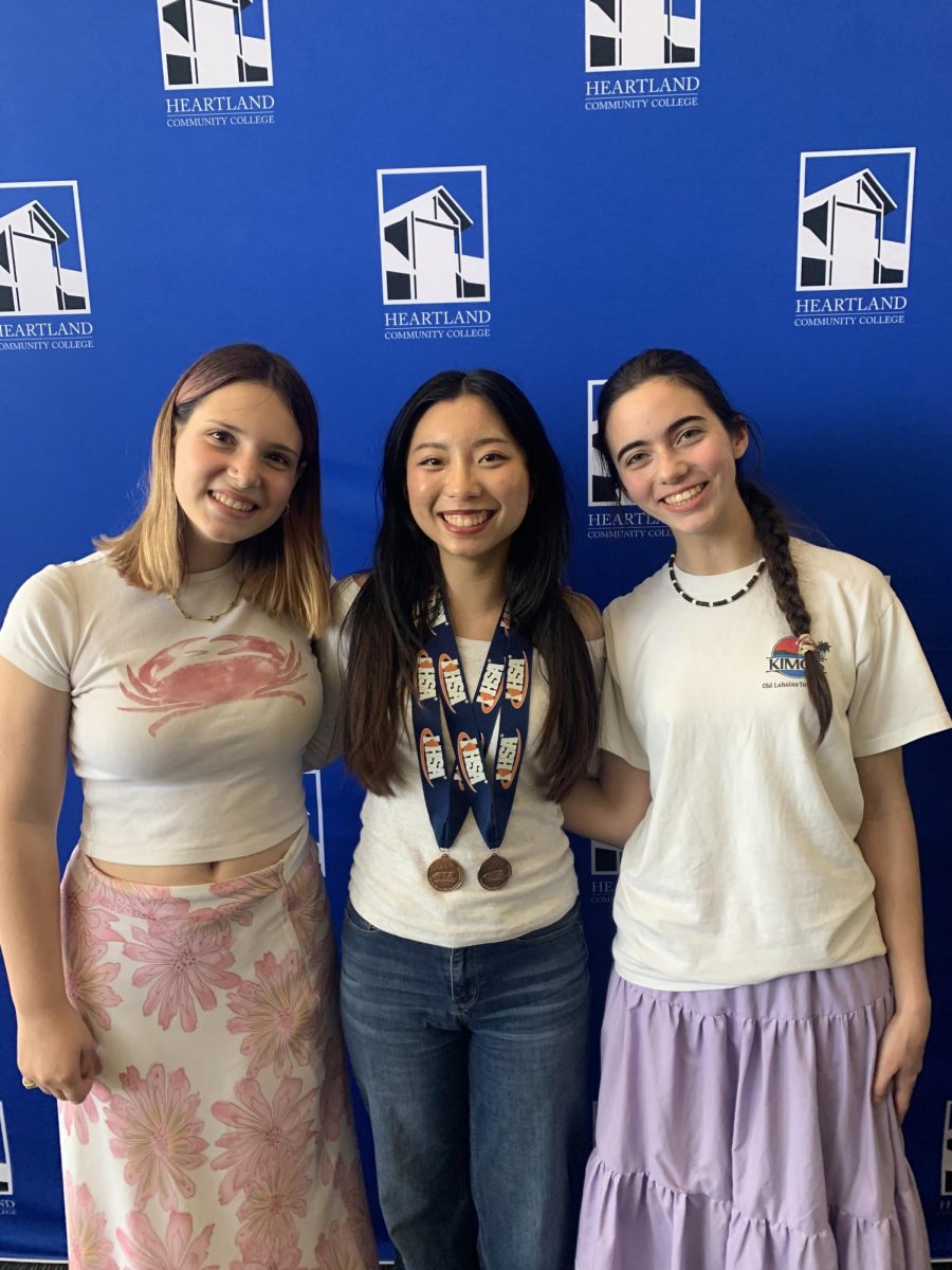 Lane Tech journalism students qualify for the State Finals:
Sophie Wu, center, finished 4th in Newspaper Design and 6th

in Editorial Writing. State qualifiers Dash Rorem, left, competed in Editorial Cartooning, and Ellie Sanderson, right, competed in Copy Editing.