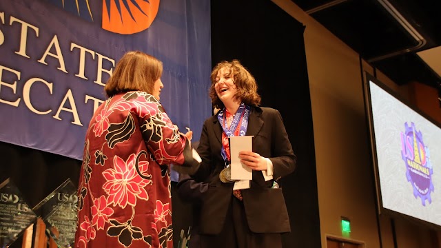 Drew Hogan receives award at nationals.