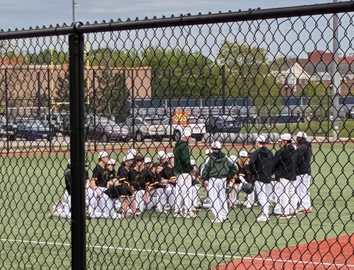 Lane Tech's team debrief after the game at Kerry Wood Stadium. 